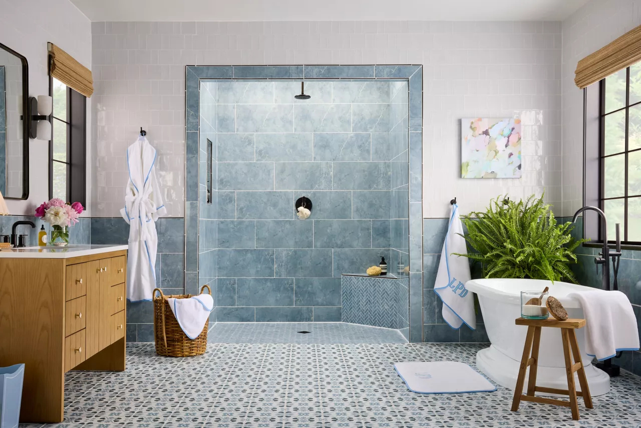 Tiled shower and bathroom floor with visible tile installation